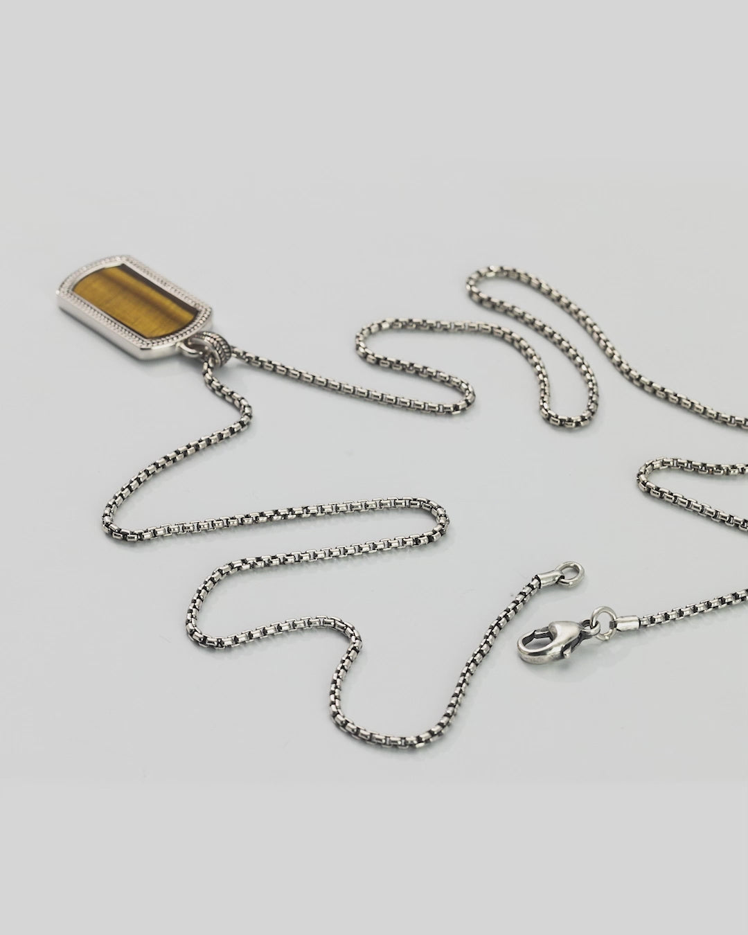360 degree video of the Tiger's Eye Gemstone Plaque Sterling Silver Pendant Necklace with full and close up views. 