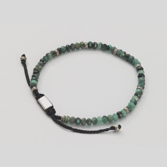 360 video of Jan Leslie Faceted Emerald Gemstone Bracelet with Black Pull Cord. Video shows full bracelet and closeup of faceted emeralds and sterling silver spacers. 