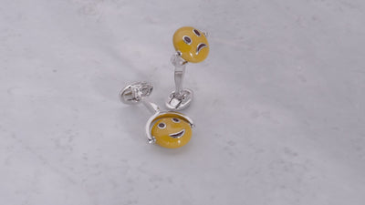 Video of 180 degree view of Jan Leslie's Flip Happy/Sad Emoji Sterling Silver Cufflinks. 