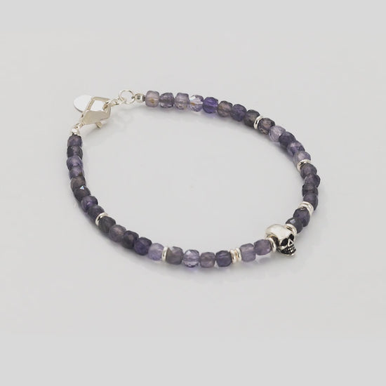 Video of 360 degree view of the Faceted Rutilated Quartz Gemstone Beaded Bracelet with Sterling Silver Skull.