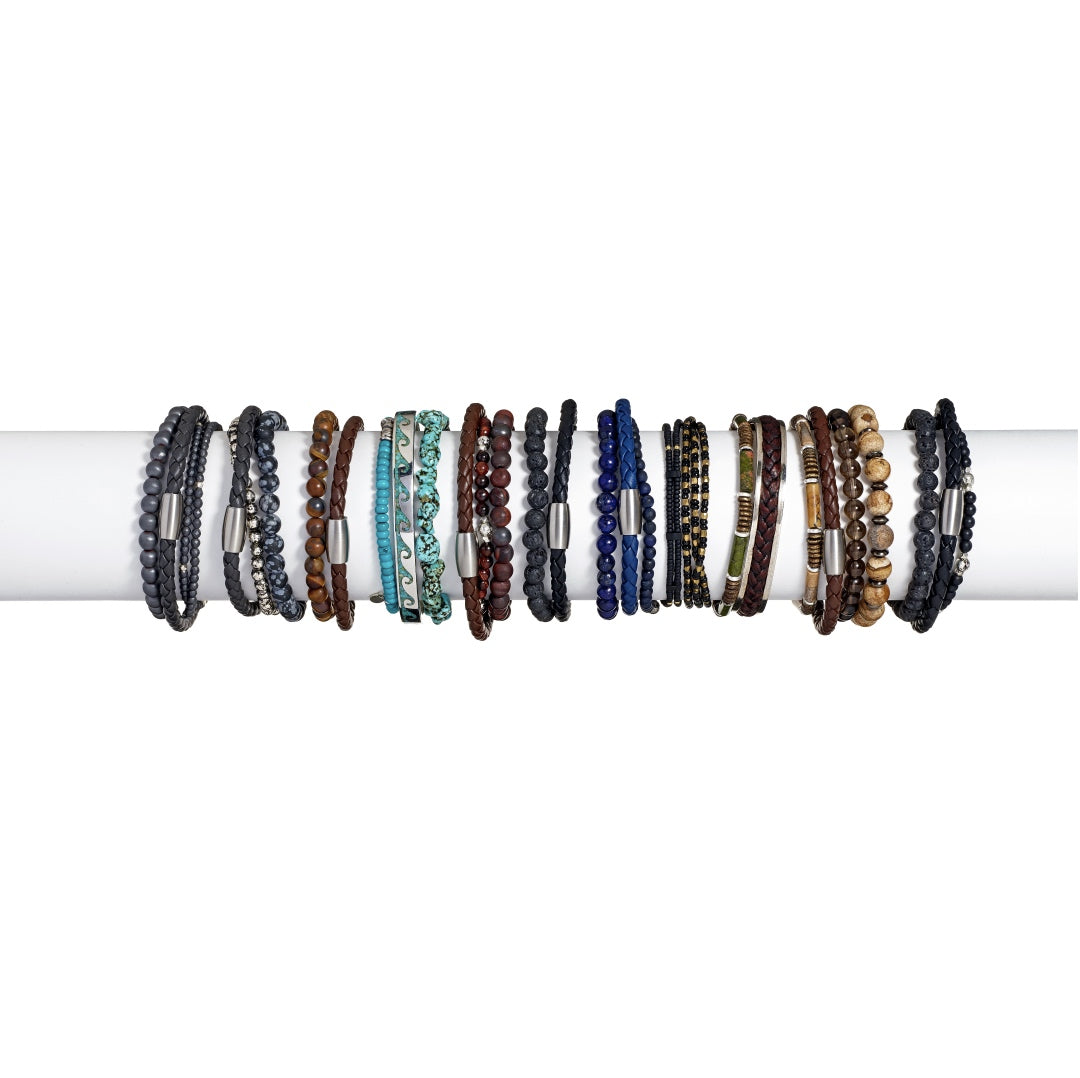 Men's gemstone and leather bracelet stack collection flat-lay showing twelve colorways